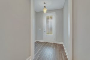 Entryway with upgraded front door with frosted glass