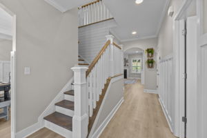 Front Entry Detail with custom wainscoting and updated stairway