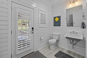 Pool bath with door to backyard