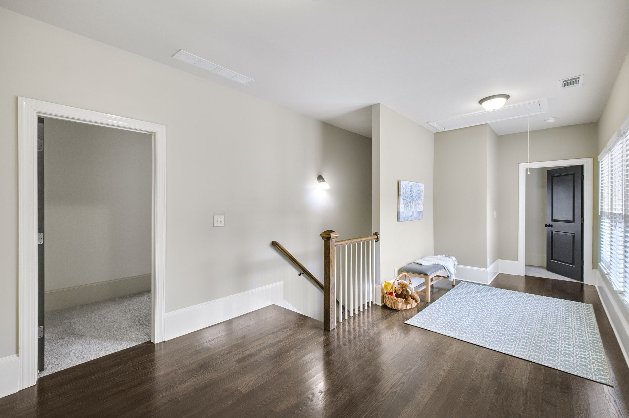 The size of this loft can accommodate a place for kids to do homework and a play area.