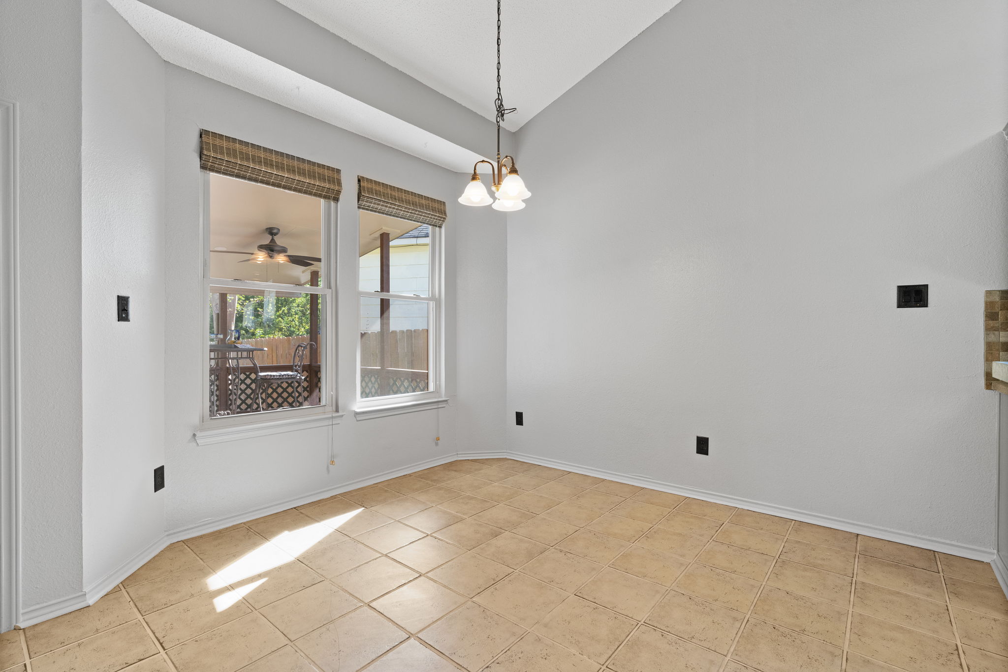 Dining Area overlooks Back Patio/Deck