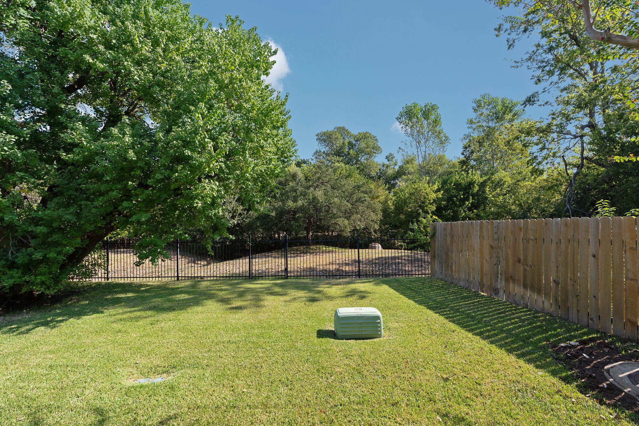 Wrought Iron back fence with gate backs to greenbelt and trail system. Note gate.