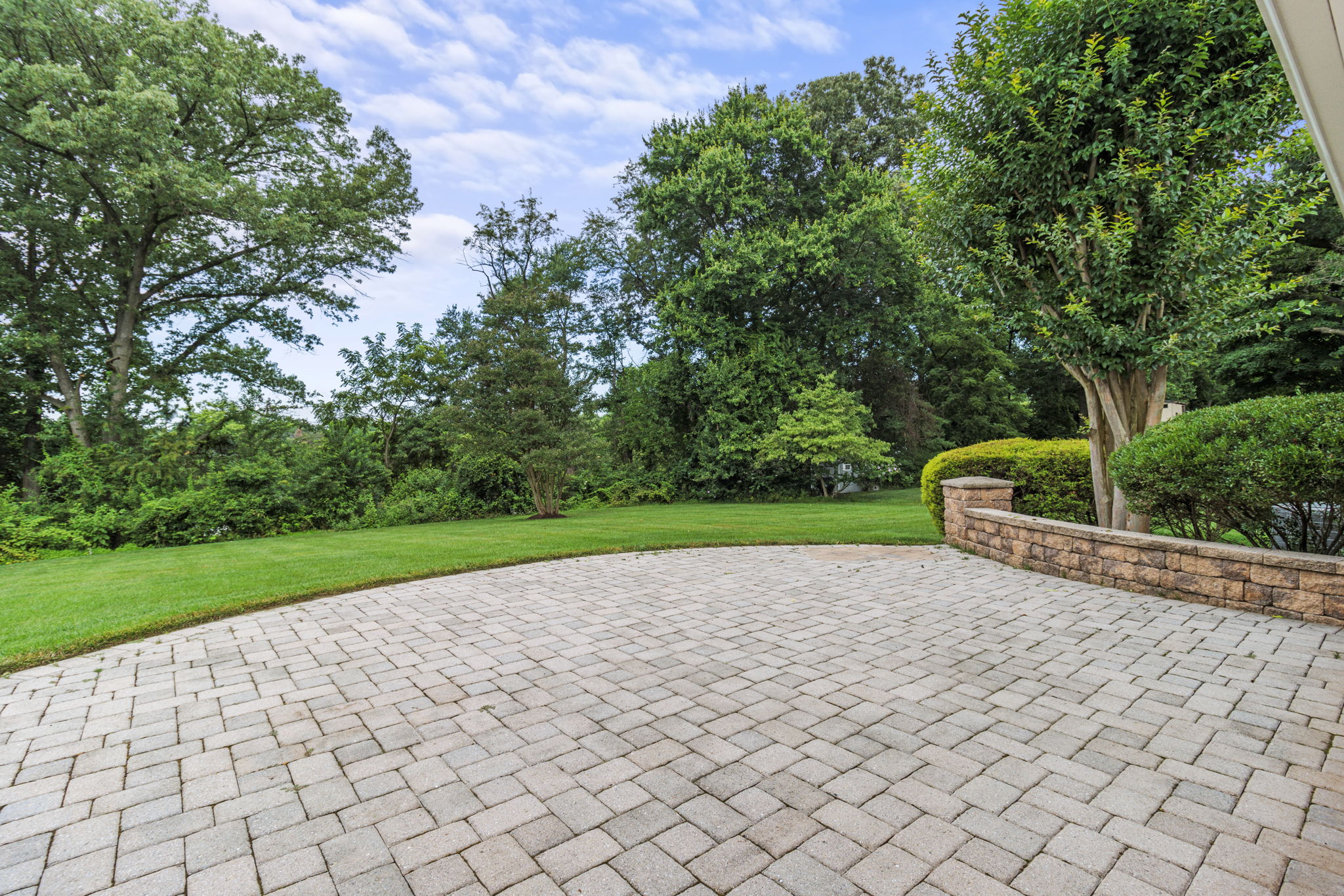 Expansive rear patio with private yard views