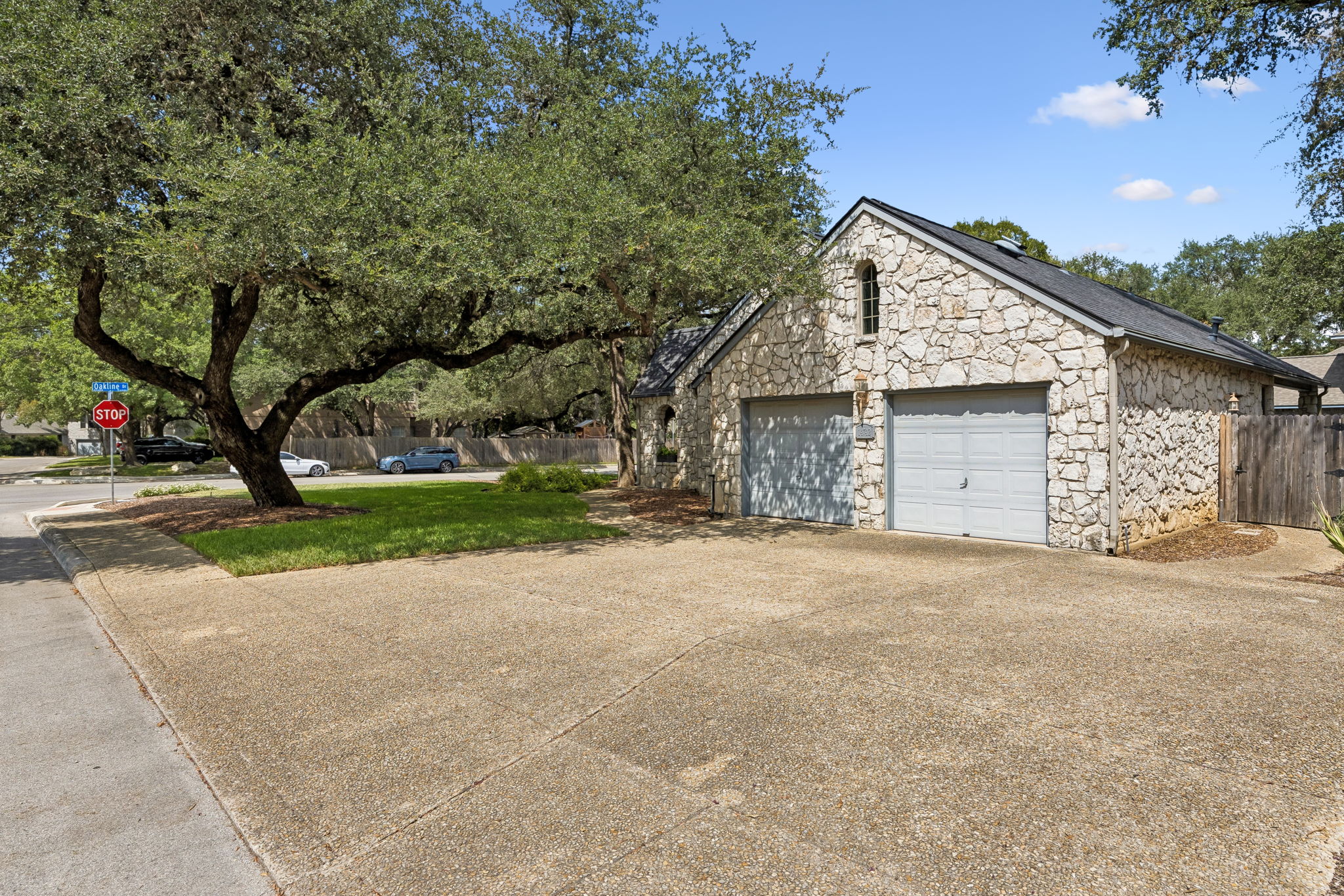 Two car garage with extra driveway space.