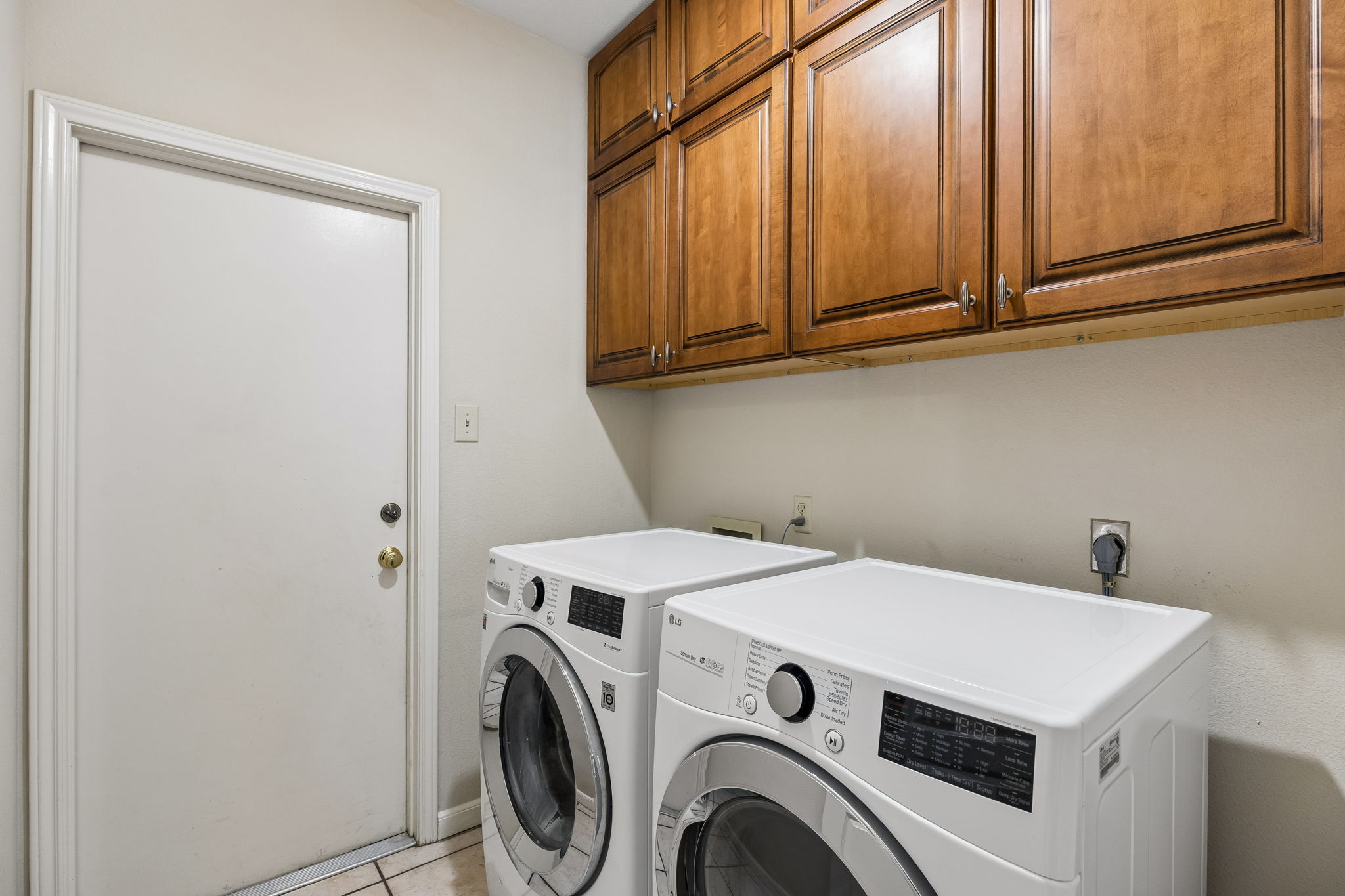 Laundry room includes washer and dryer.