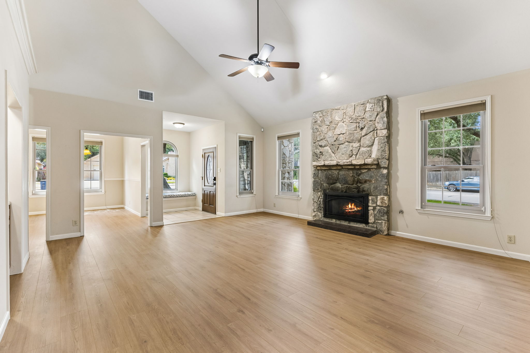 Rock fireplace in family room/open to dining room.