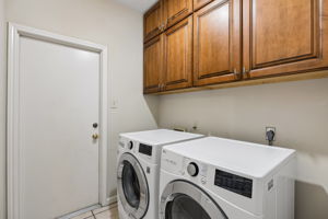 Laundry room includes washer and dryer.