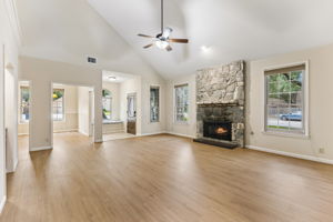 Rock fireplace in family room/open to dining room.