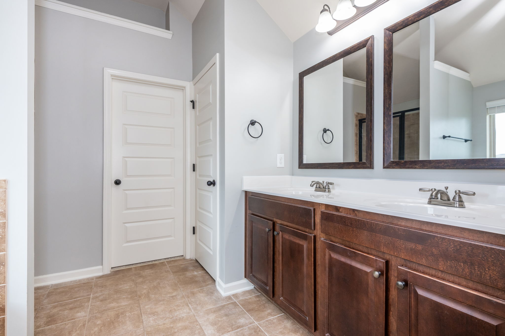 Master Bath has Separate Tub & Shower w 1 of 2 Closets.