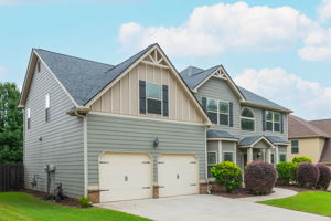 Level Driveway & Garage has custom Wood shelves for storage.
