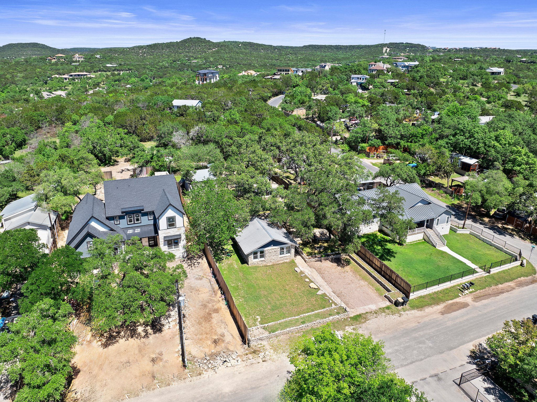 Live near Lake Travis! Great property with two houses! The property is the one in the middle.