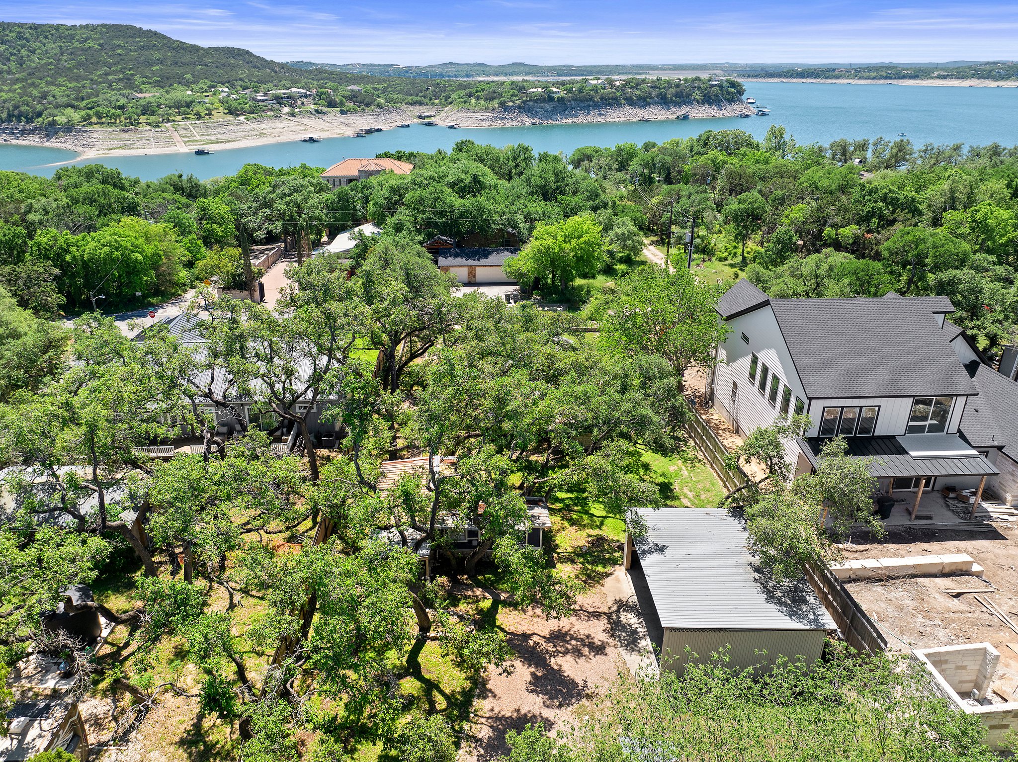 Live near Lake Travis! The property is the one with the light gray roof. There are two houses.