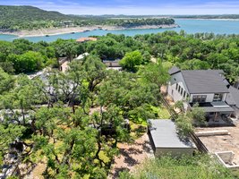 Live near Lake Travis! The property is the one with the light gray roof. There are two houses.