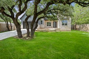 Tree-covered front yard.