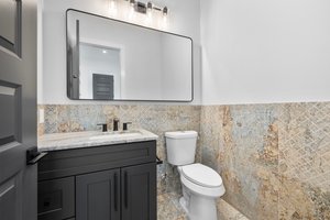 Powder room on the lower level off of the entry hallway.