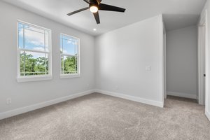 Bedroom 4 on the upper level with its own bathroom.