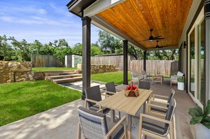 Enjoy the peaceful back yard on the large, covered patio. Virtually staged.