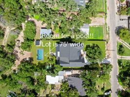 There is NOT a pool. Pic is for demonstration purposes only. The lot is 75' wide, and the upper level of the back yard is appx 50' deep.