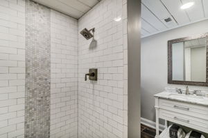 25.	Full remodeled bath on first level, new tiled shower, vanity