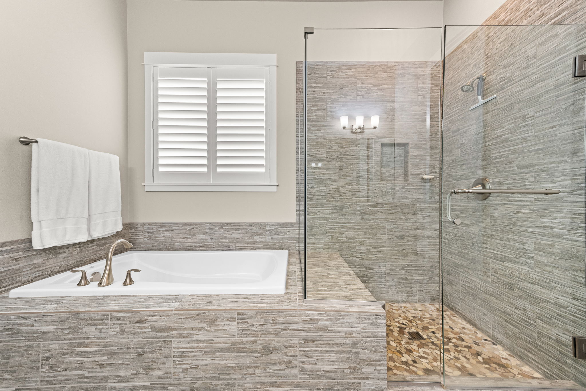 Large soaking tub and shower with built in bench