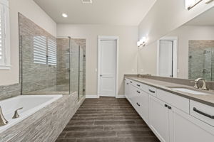 Spacious primary bath leading to walk in closet