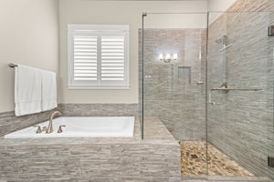 Large soaking tub and shower with built in bench