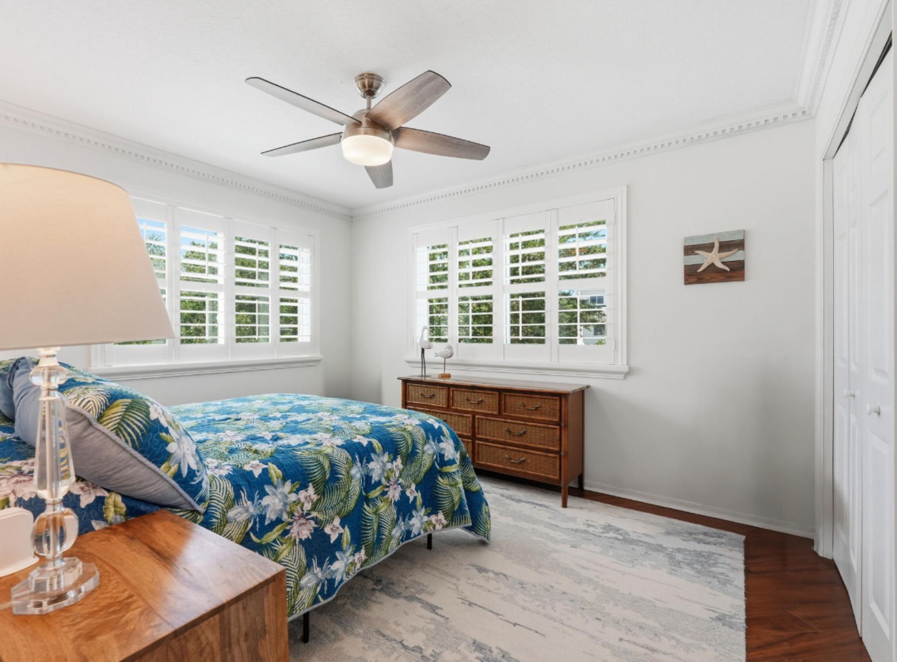 2nd Floor Bedroom with plantation shutters, storm windows and amazing natural light
