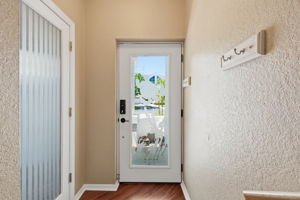 Etched Front Door adds light to the entire townhome.  Door to the Left heads into Garage and downstairs Bonus Room