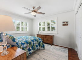 2nd Floor Bedroom with plantation shutters, storm windows and amazing natural light