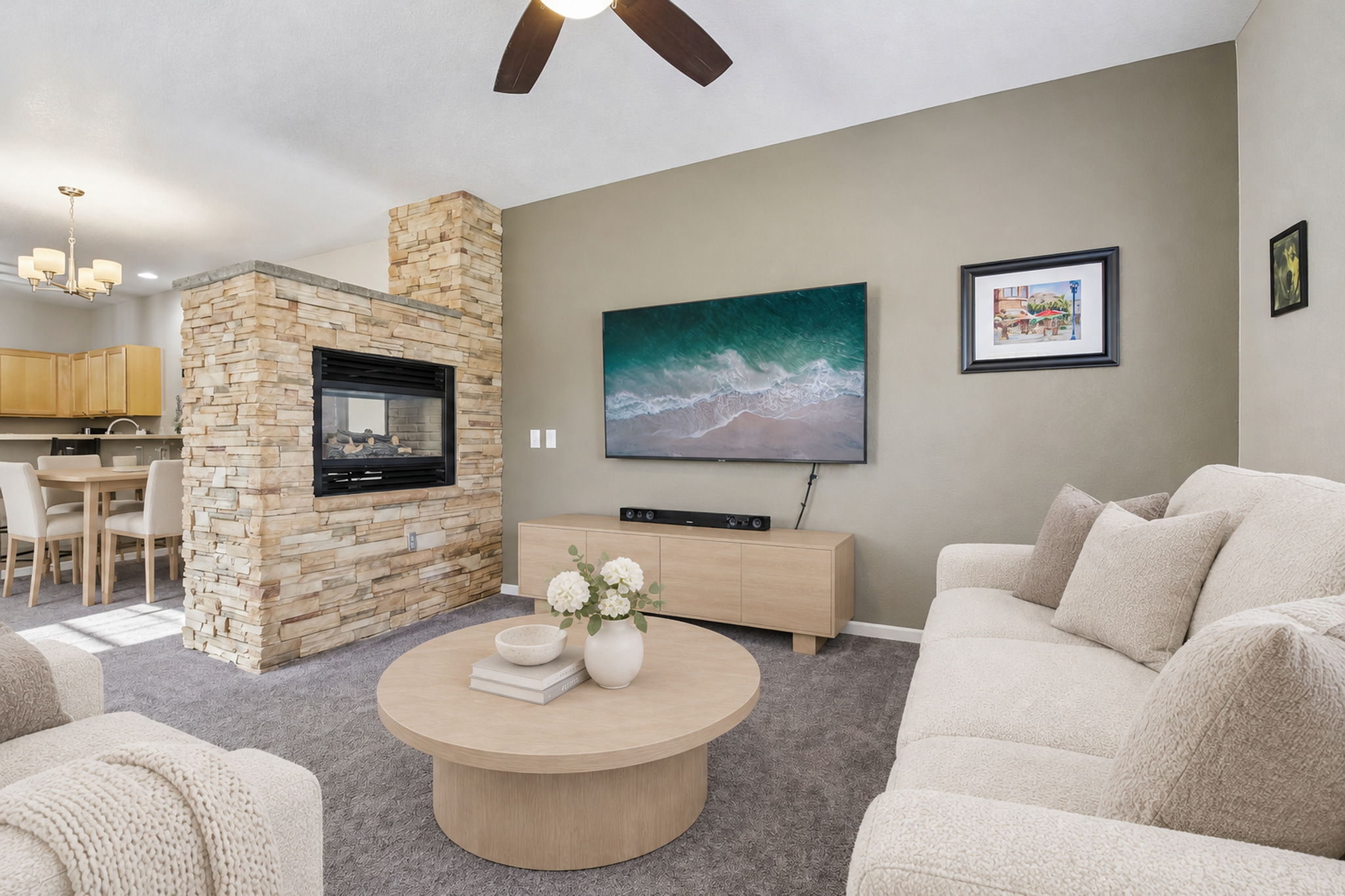 Room is virtually staged. Family room has double sided gas fireplace surrounded by stacked stone