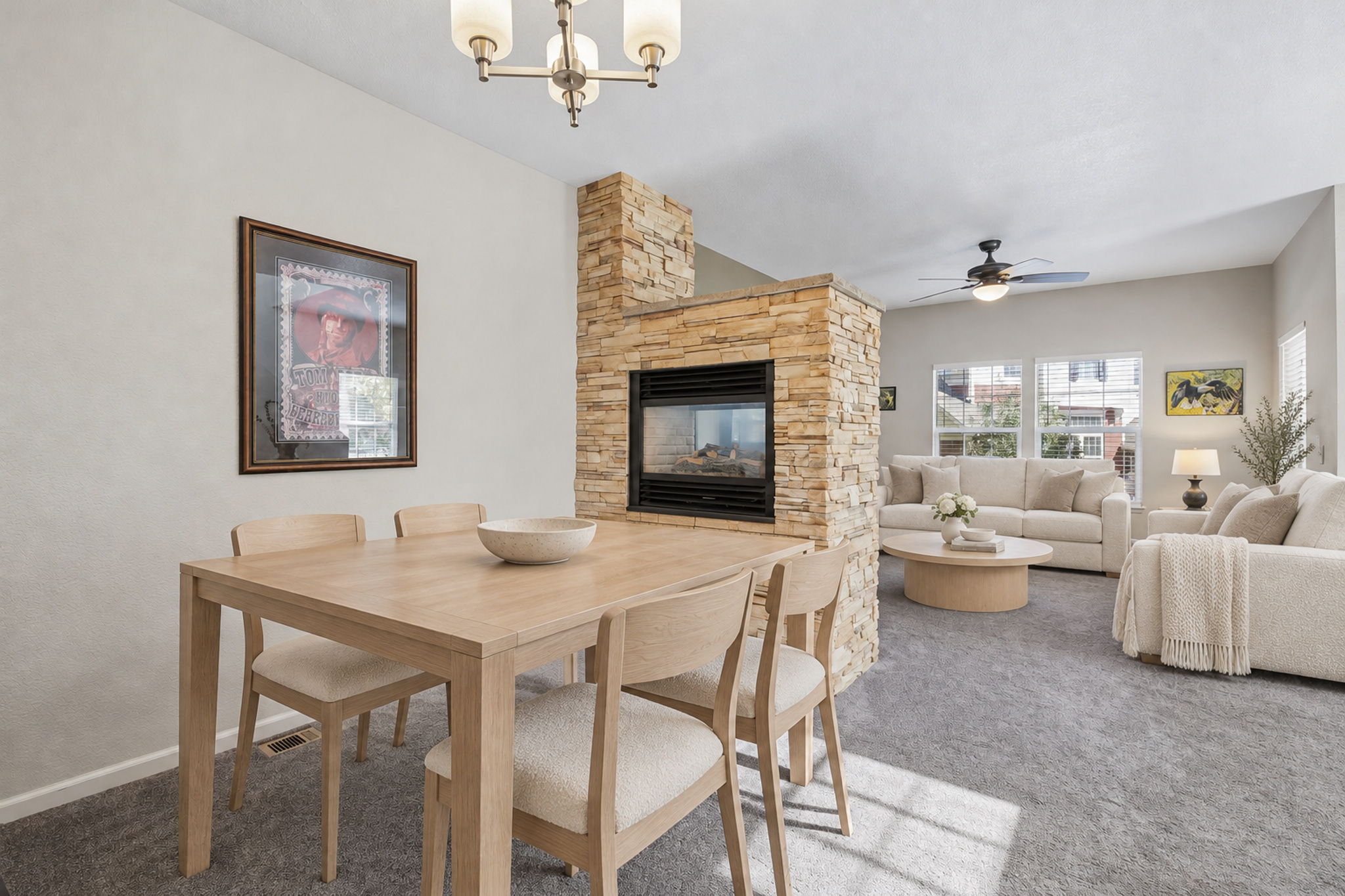 Double sided gas firepace is open to family and dining room. Virtually staged