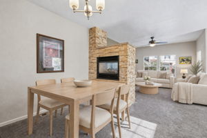 Double sided gas firepace is open to family and dining room. Virtually staged
