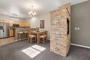 Double sided gas firepace is open to family and dining room