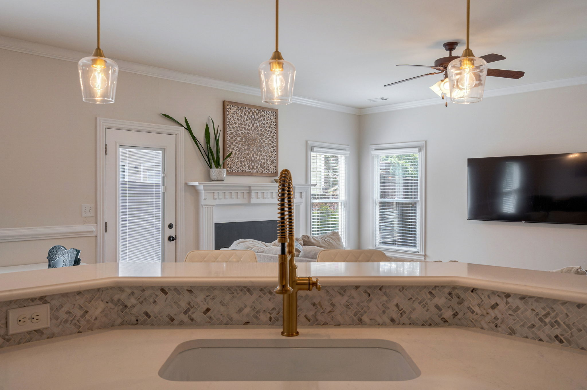 Kitchen w/ views to dining & living room