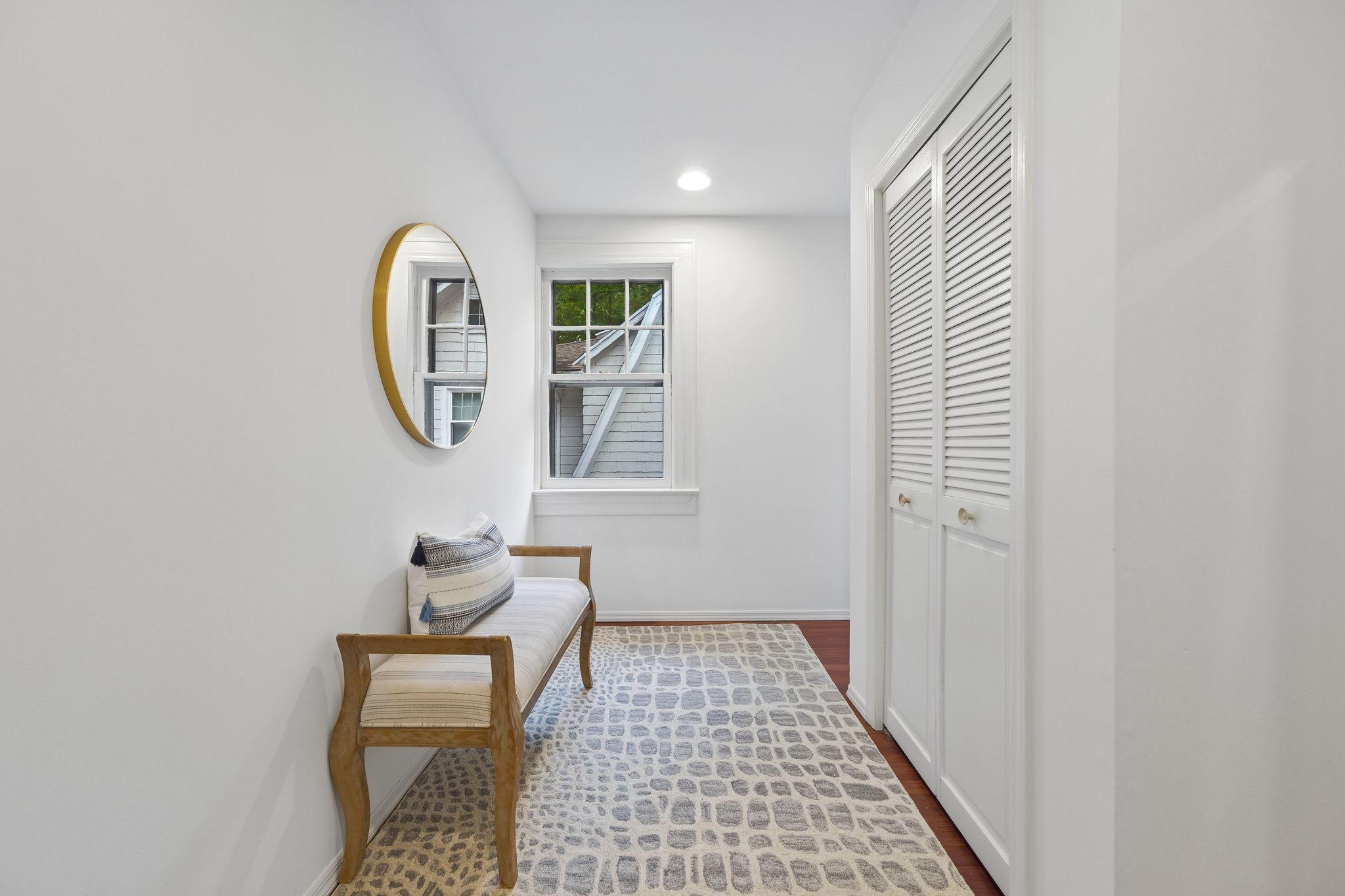 A LITTLE BREATHING ROOM UPSTAIRS. A bright landing with a place to pause and closet storage close at hand. Even the in-between spaces feel considered.