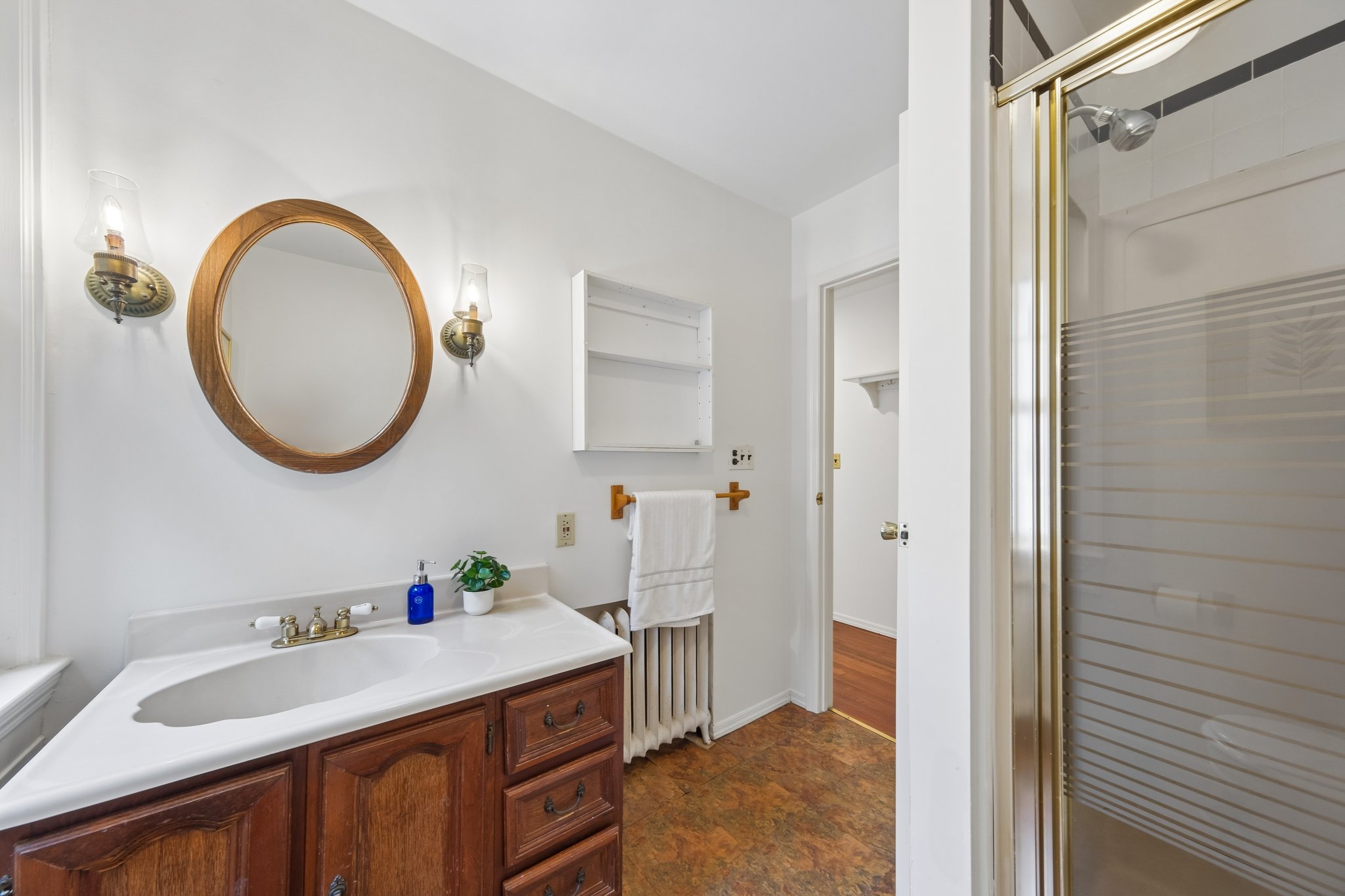 KEEP THE MORNING SIMPLE. A second full bath serves the two upstairs bedrooms, keeping daily routines on the same level as your retreat.