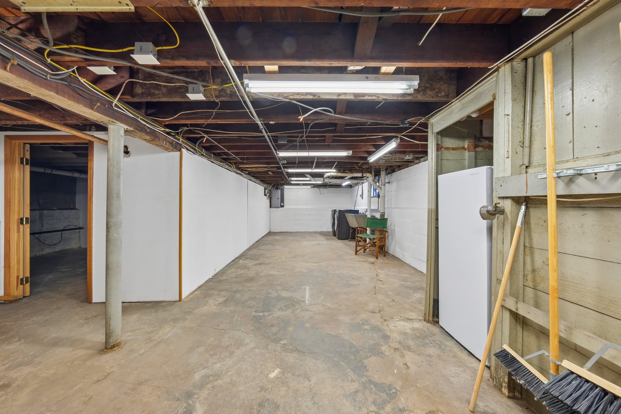 BRING YOUR IDEAS DOWNSTAIRS. A large unfinished basement offers a blank canvas for whatever you're dreaming up, with room to organize tools, supplies and hobbies.