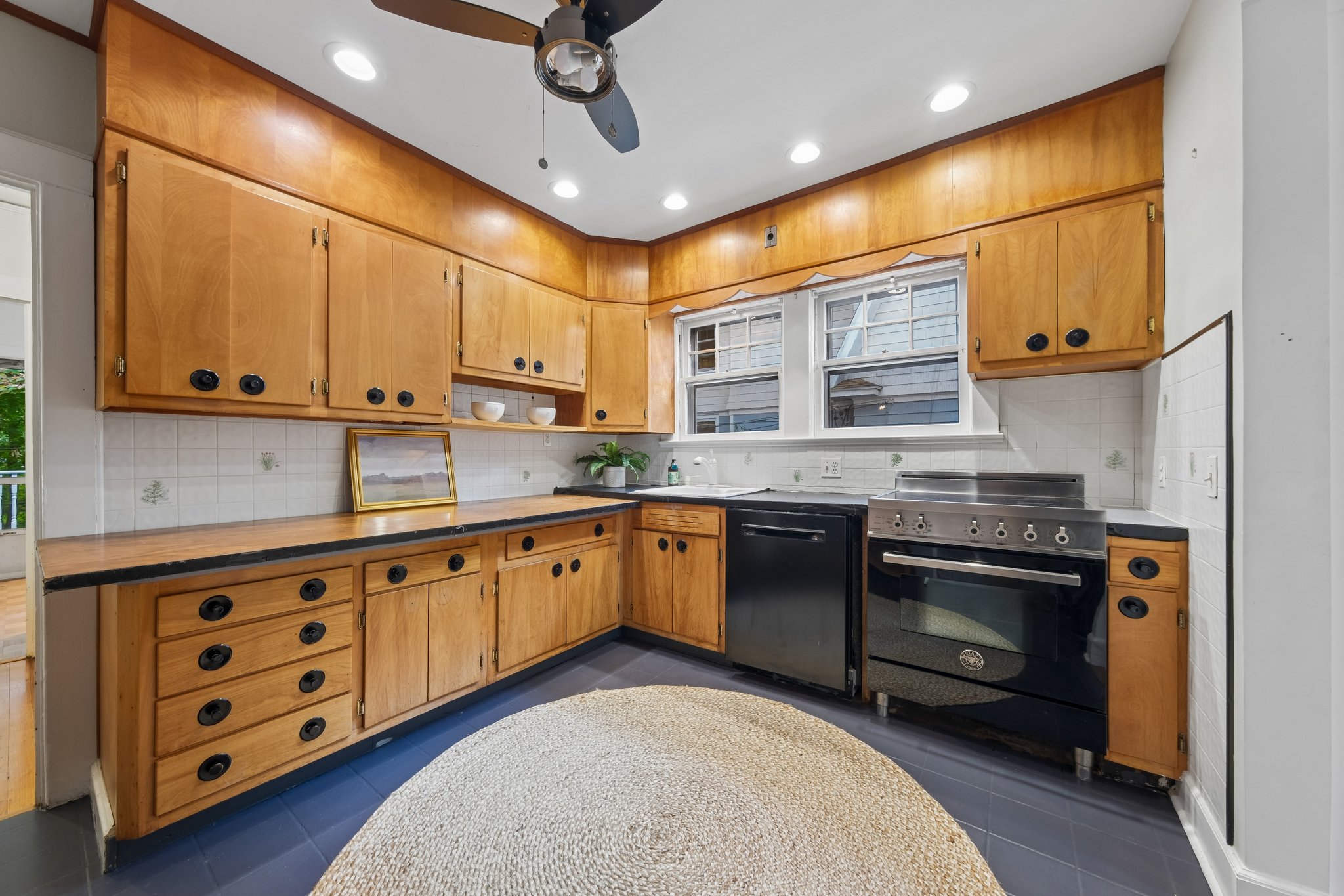 FOR THE COOK WHO LIKES TO IMPROVISE. A substantial range, generous cabinetry and a kitchen with character. Follow a recipe or see where the evening takes you.