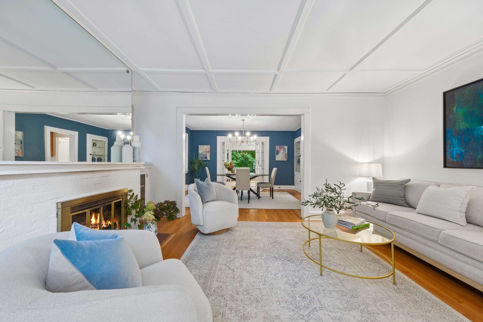 SETTLE IN AND STAY AWHILE. The living room pairs a wood-burning fireplace with an easy connection to the dining room. Start with drinks here; let dinner take its time or order from one of Montclair's many fabulous restaurants!