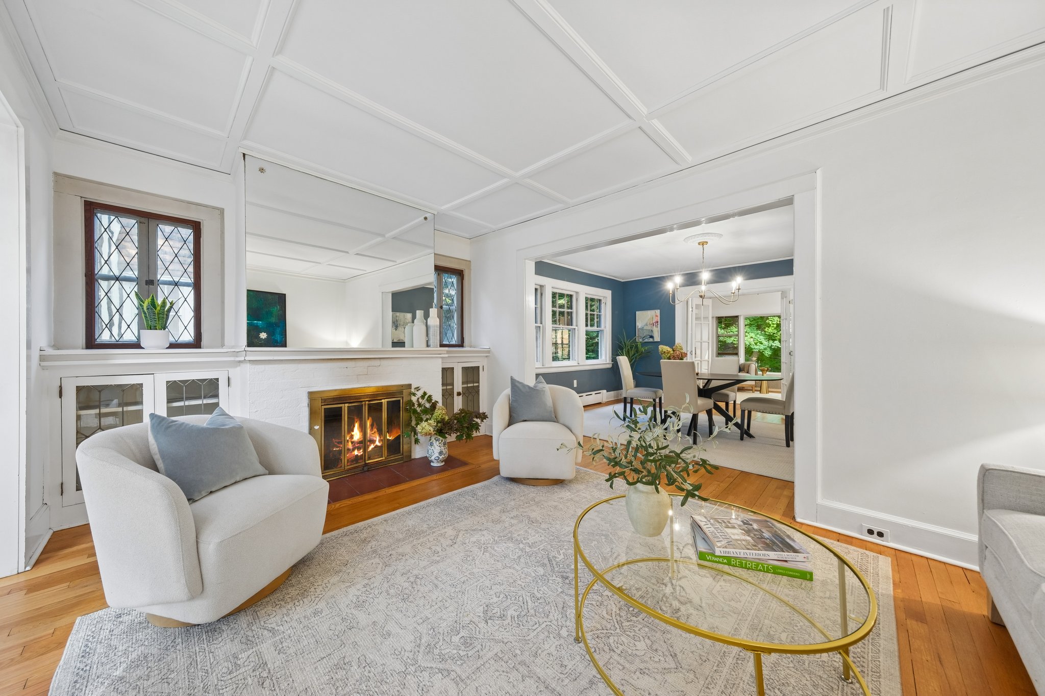 ROOM FOR CONVERSATION. Pull up a chair, put on some music (maybe “Montclair, NJ 1956” by Elijah Fox) and let the evening unfold. The living room feels connected to the rest of the house without losing its cozy character.