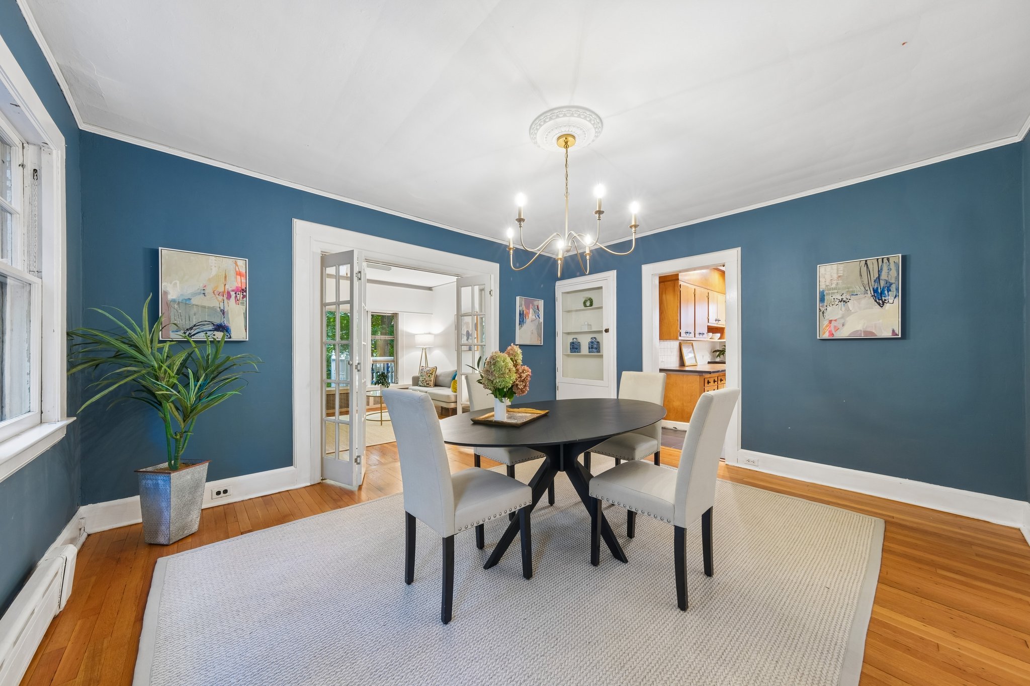 MAKE DINNER AN OCCASION. Rich blue walls set the scene for candlelight, a favorite recipe and the people who always stay for one more story.