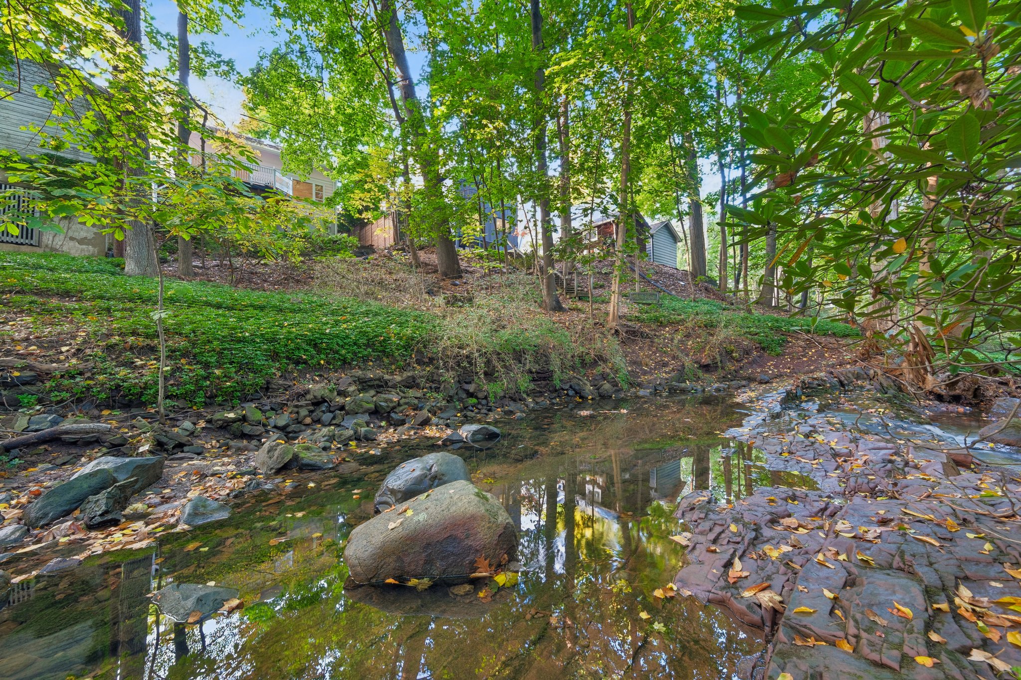 THE SOUNDTRACK IS ALREADY HERE. Well below the house, the Second River meanders through the woods, bringing the gentle sound of moving water to your backyard retreat. Pull up a chair. Let the day slow down. This home is NOT in a flood zone and flood insurance is NOT required.