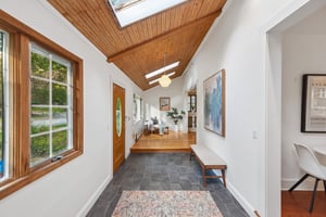 COME IN. EXHALE. A wood-lined ceiling and a ribbon of skylights make the entrance feel like the beginning of your weekend, whatever day it happens to be. See floor plans for generous dimensions.