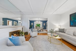 SETTLE IN AND STAY AWHILE. The living room pairs a wood-burning fireplace with an easy connection to the dining room. Start with drinks here; let dinner take its time or order from one of Montclair's many fabulous restaurants!