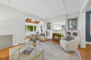 CHARACTER WORTH KEEPING. A paneled ceiling, wood floors and leaded-glass windows give the living room the warmth that makes an older home so appealing.