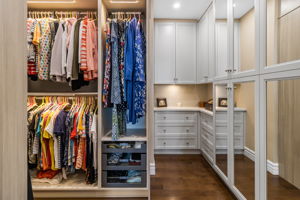 Ensuite Walk-in Closet with Custom Cabinetry