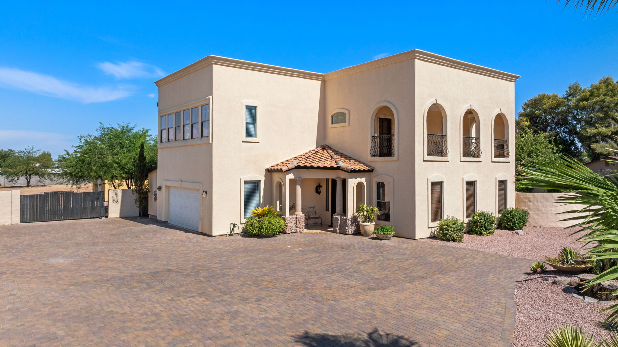 Property front and view of the garage entrance