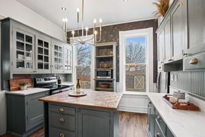 Kitchen with calcutta marble countertops