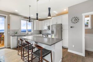 Upgraded Pendants, Quartz Counters, All Appliances Stay