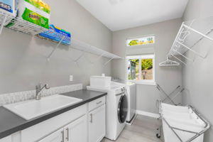 Laundry Room with Utility Sink, Washer and Dryer Stay